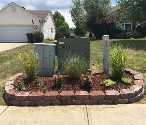 disguising electric boxes in garage|electrical boxes in front yard.